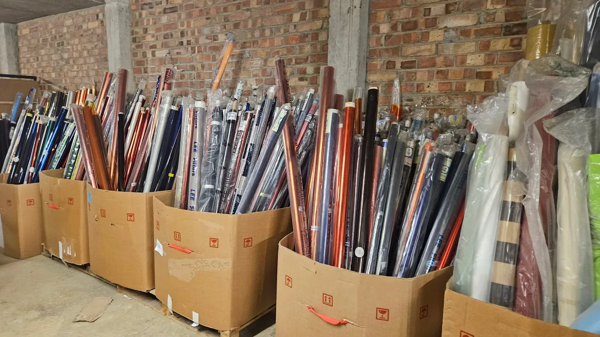 A wide view of the Scrapstore's interior, shelves stacked with rescued materials
