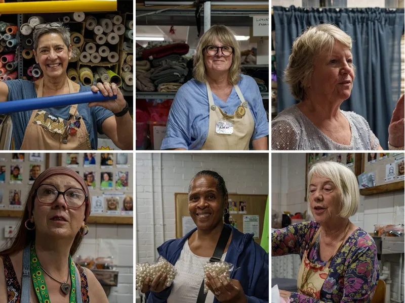 Six of Scrapstore's store volunteers, smiling among the shelves