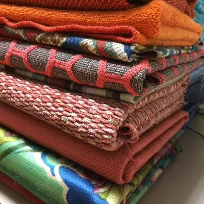 Folded stacks of donated patterned fabric