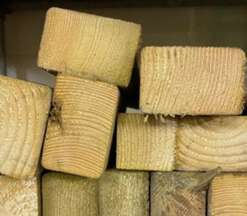 Offcuts of timber stacked on a shelf, rescued for reuse